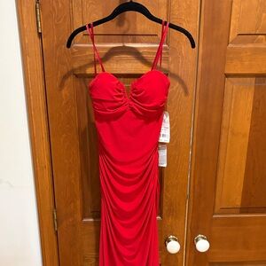Stunning, long red dress by Haley Logan size 7-8never been worn with tags